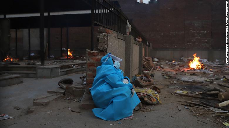 A woman at a crematorium in New Delhi, India, on May 8 mourns a relative who died from Covid-19.