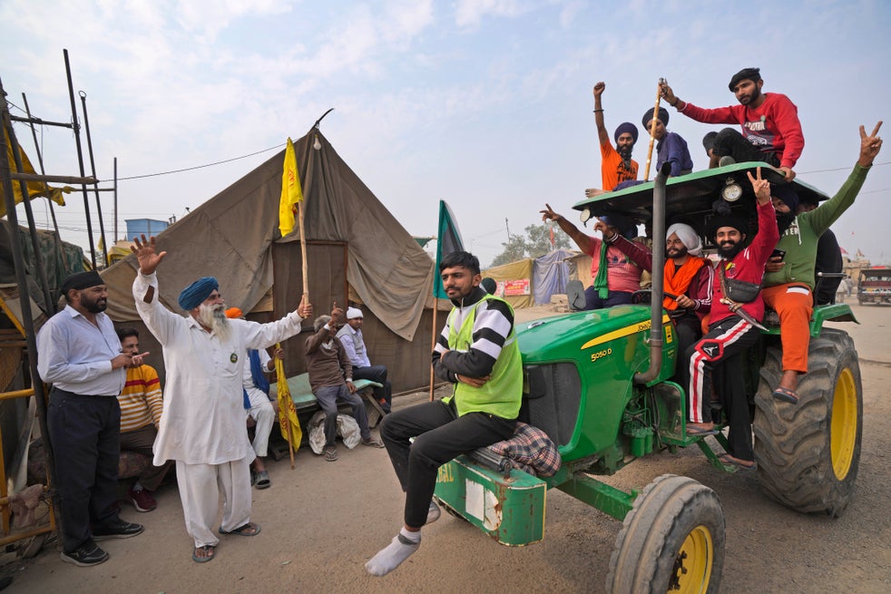 <p>Farmers celebrate news of the repeal of India’s farm laws</p>