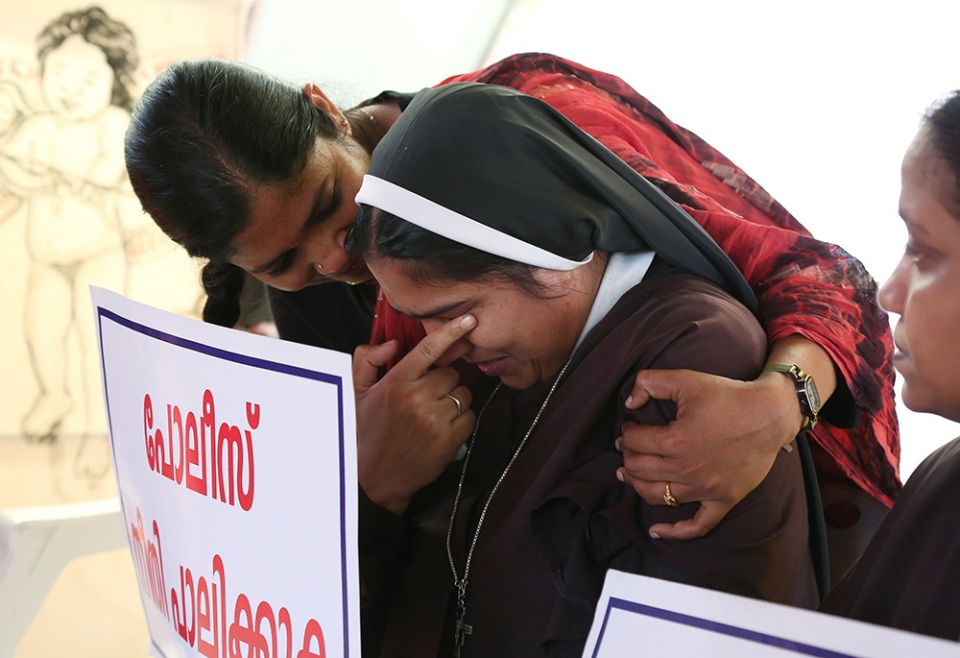 A woman religious is consoled during a Sept. 13, 2018, protest in Cochin, India, demanding justice after a nun accused Bishop Franco Mulakkal of Jalandhar of raping her. (CNS/Reuters/Sivaram V)