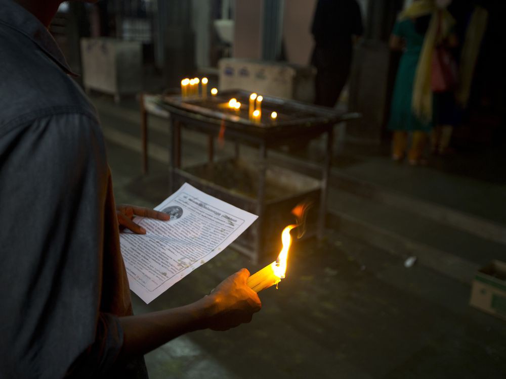 In this Saturday, Nov. 3, 2018, photo, a devotee prays at St. Mary's Church in Kottayam in the southern Indian state of Kerala. For decades, nuns in India have quietly endured sexual pressure from Catholic priests, an AP investigation has revealed.